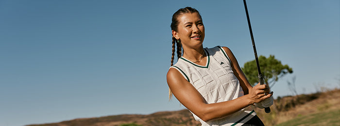 Sleeveless knit from Adidas at GolfGarb in cream with classic green detail