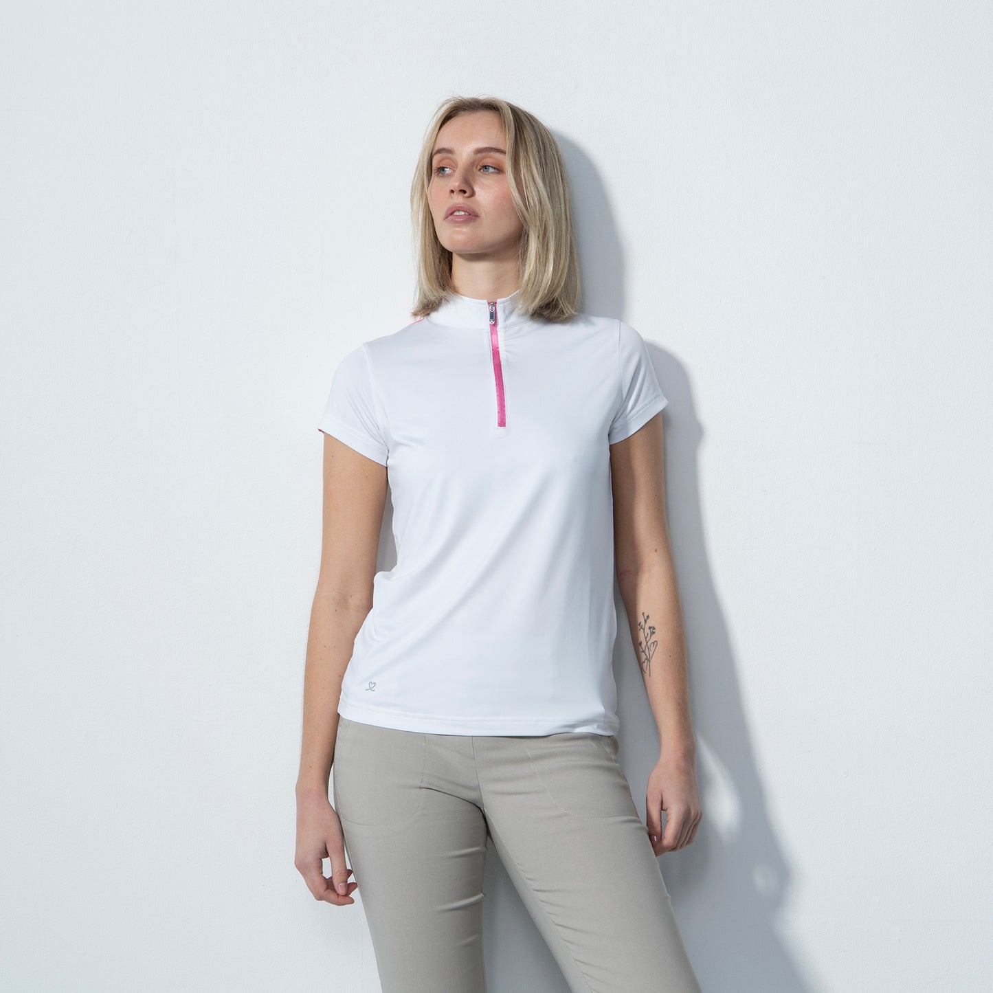 Daily Sports Ladies Cap Sleeve Polo in White with Silver Studded Print on the Back