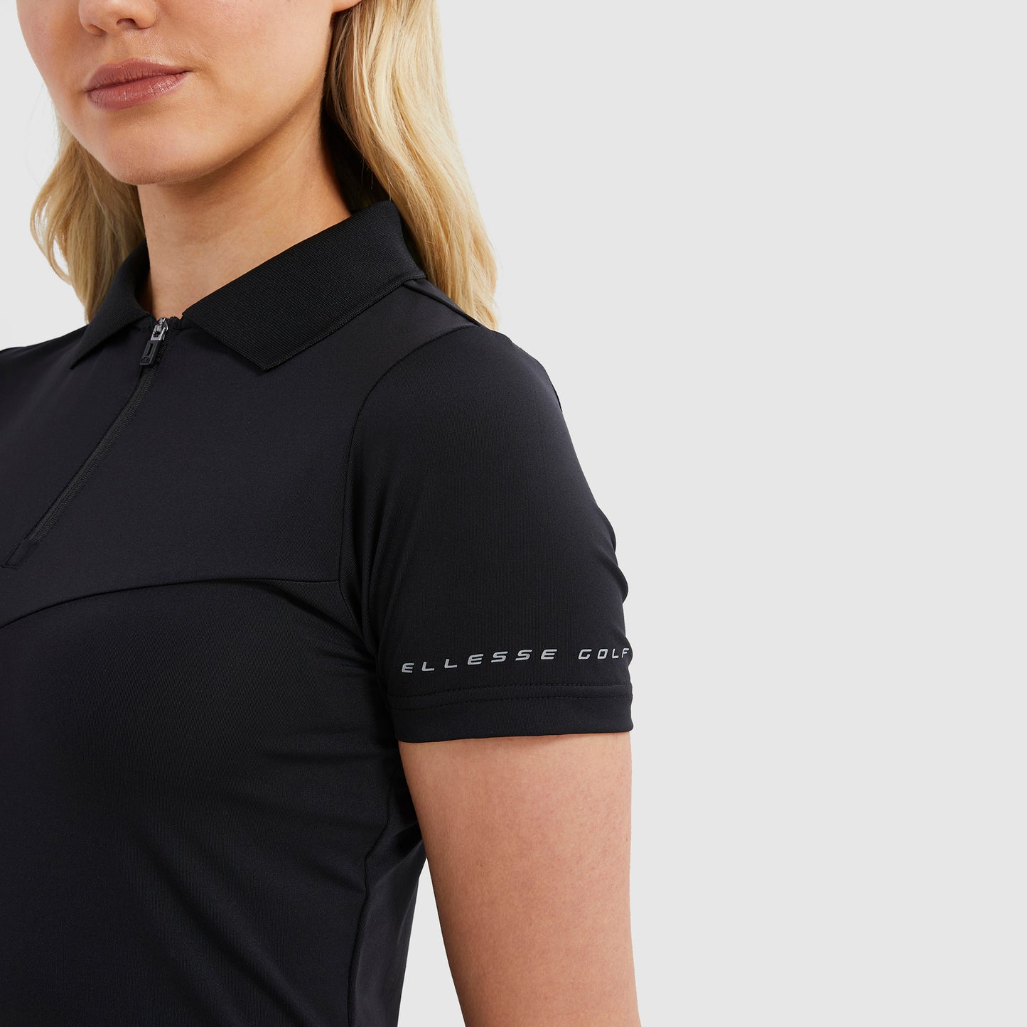 Ellesse Ladies Short Sleeve Polo in Black with Zip-Neck