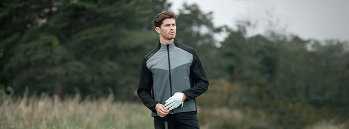 Man in callaway grey and black full zip golf jacket