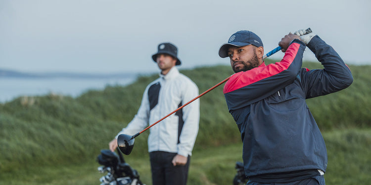 two male golfers in galvin green outerwear
