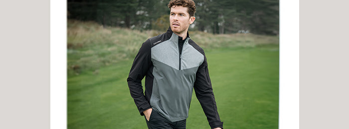 Man in callaway grey and black golf mid layer