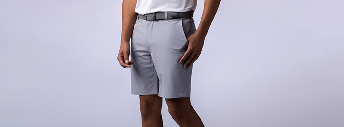 Male model in Callaway grey golf shorts