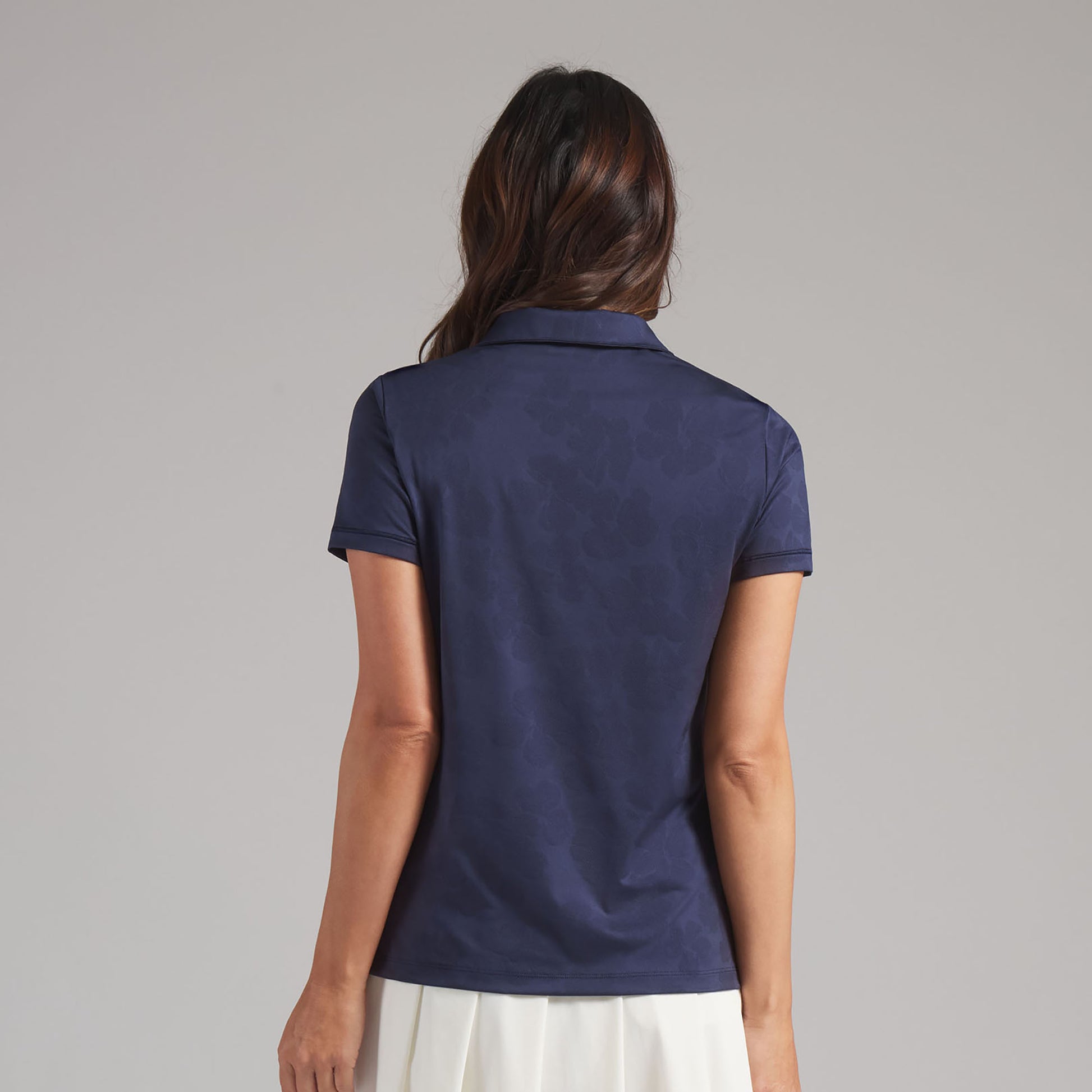 Puma Golf Ladies Short Sleeve Polo with Elegant Floral Jaquard Detail in Navy