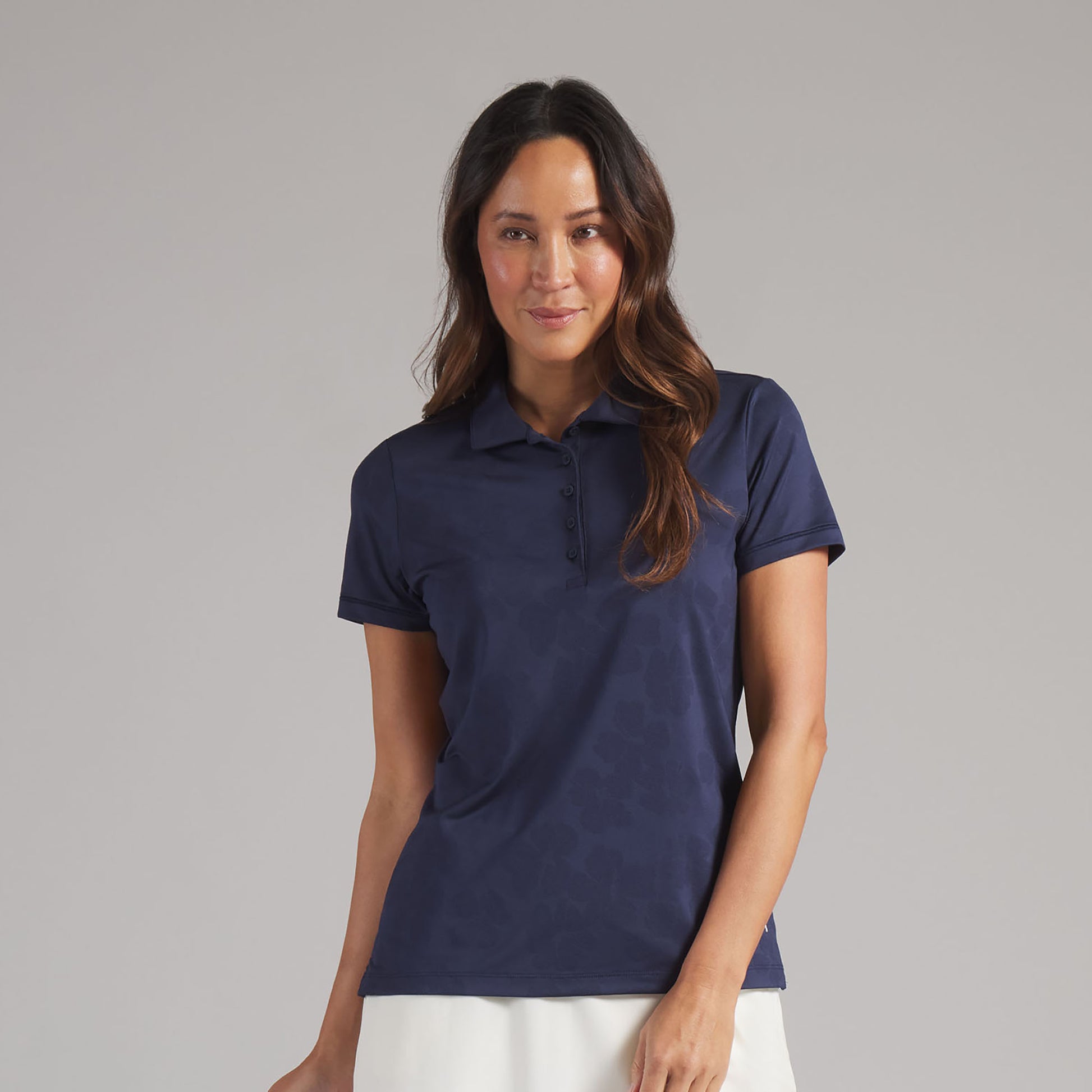 Puma Golf Ladies Short Sleeve Polo with Elegant Floral Jaquard Detail in Navy
