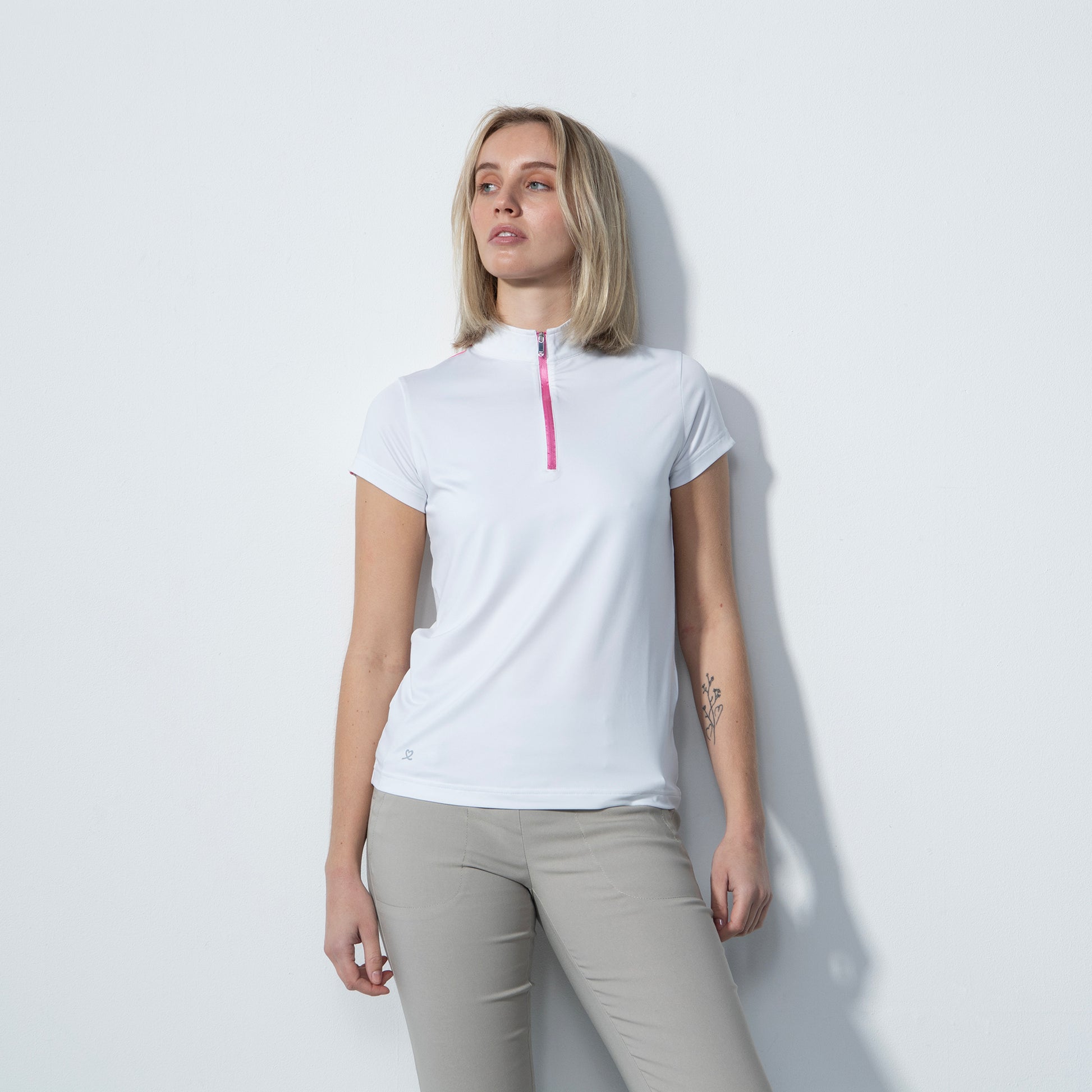 Daily Sports Ladies Cap Sleeve Polo in White with Silver Studded Print on the Back 