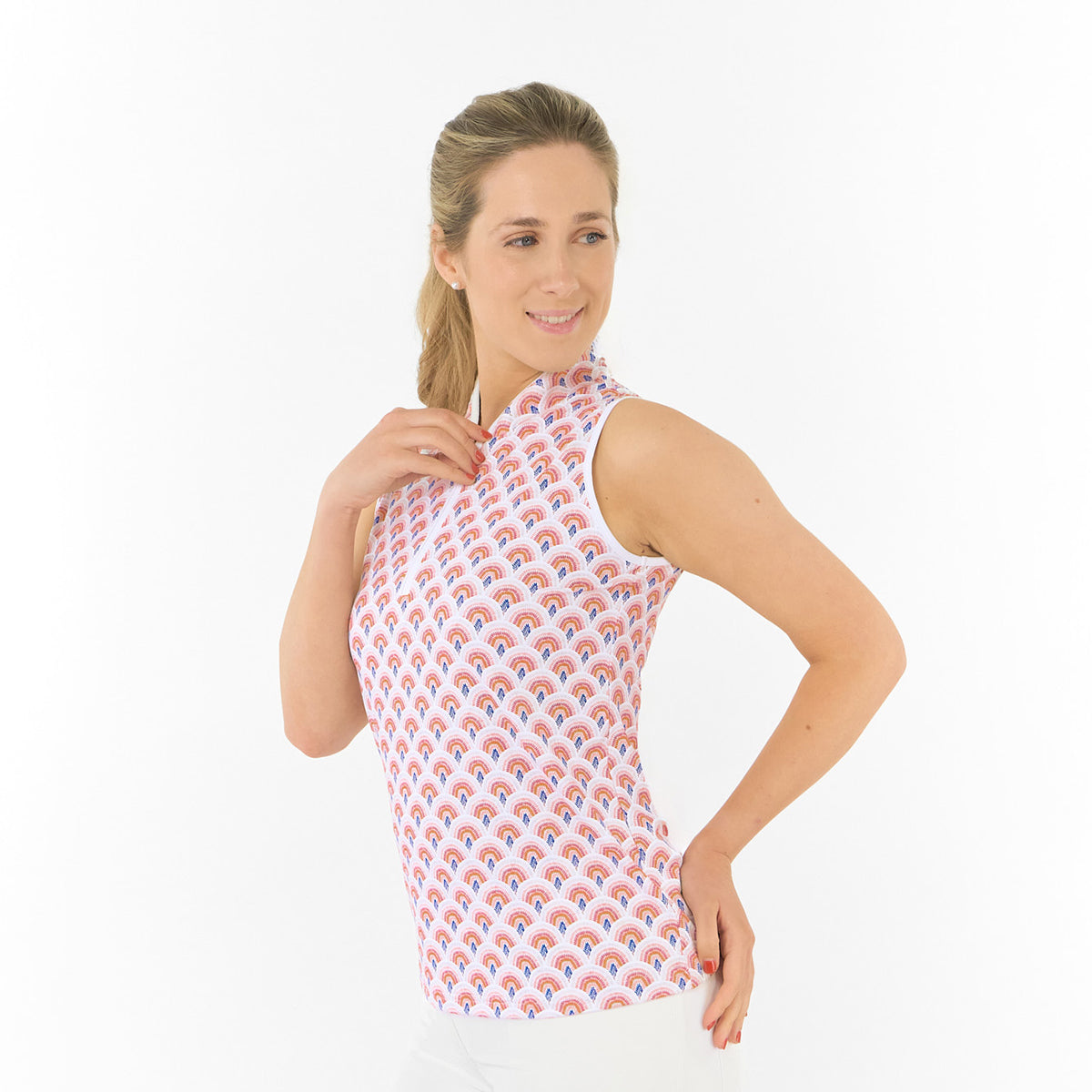Pure Golf Ladies Sleeveless Polo in Rainbow Geo Print – Dynamic Design Meets Effortless Performance