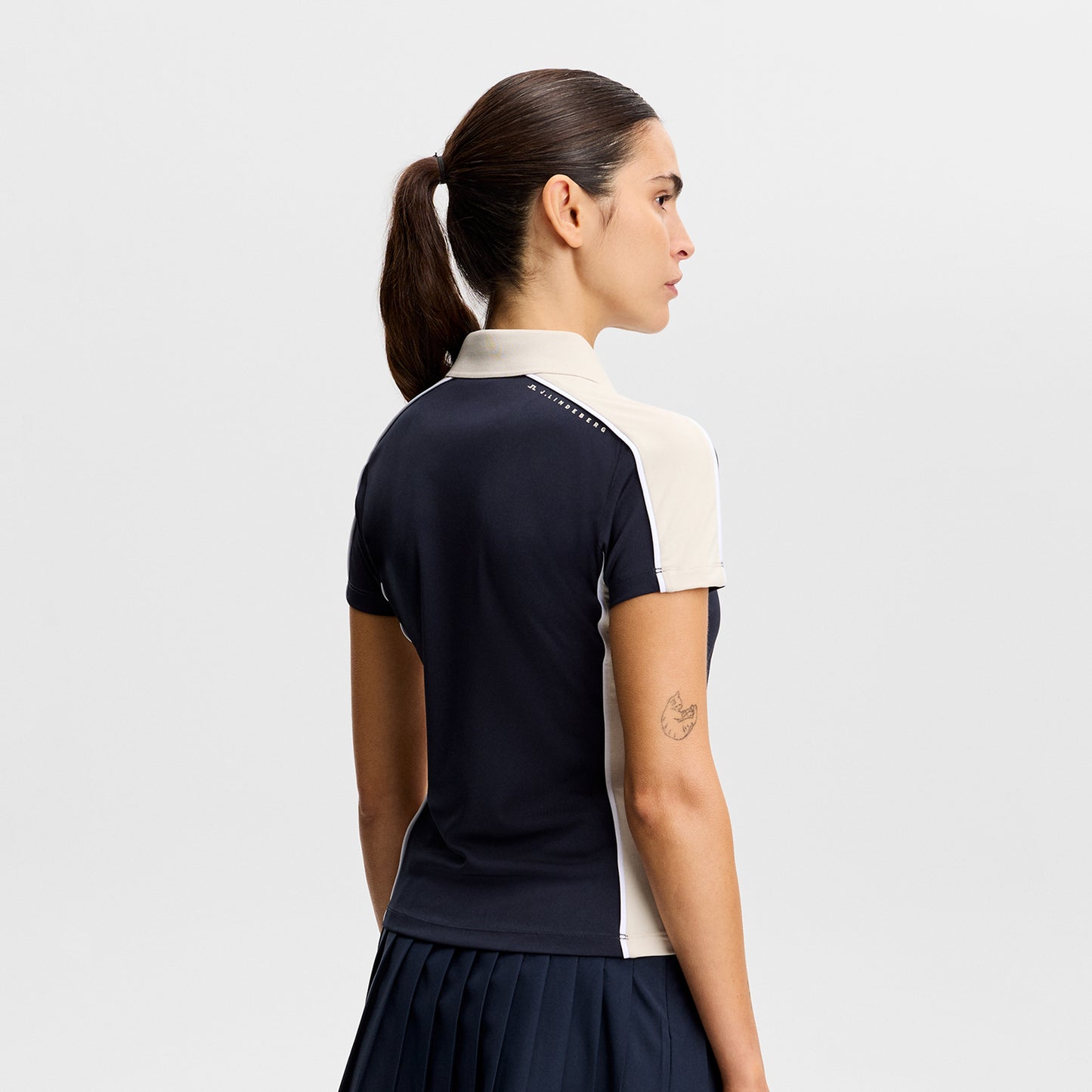 J.Lindeberg Ladies Navy Short Sleeve Polo - Feminine Fit, Confident Swing