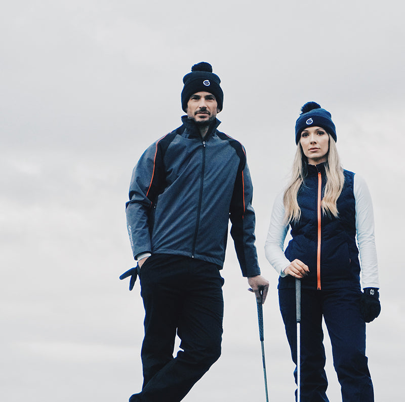 Golfers wearing Sunderland of Scotland Men's and women's golf trousers, gilet and jacket