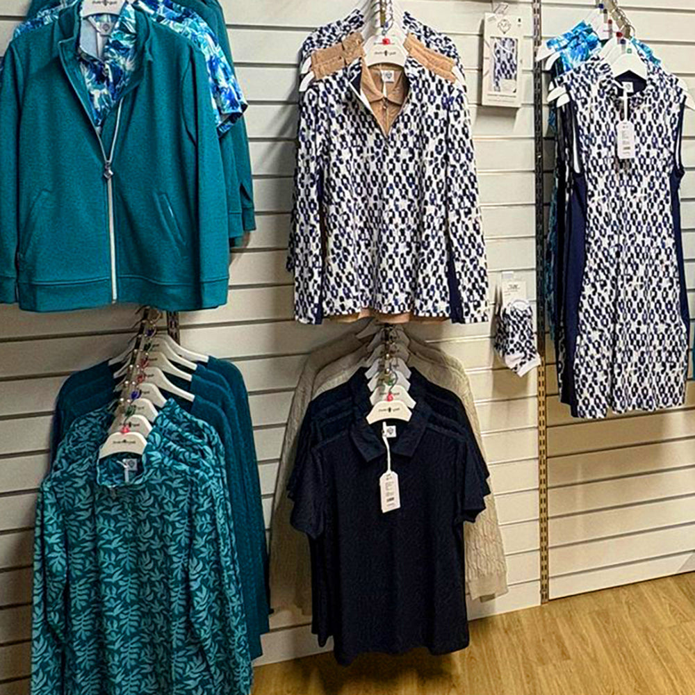 Blue and aqua designs from Pure Golf's 2026 collections on display at the GolfGarb concession at Tony Valentine Golf Centre, Corsham