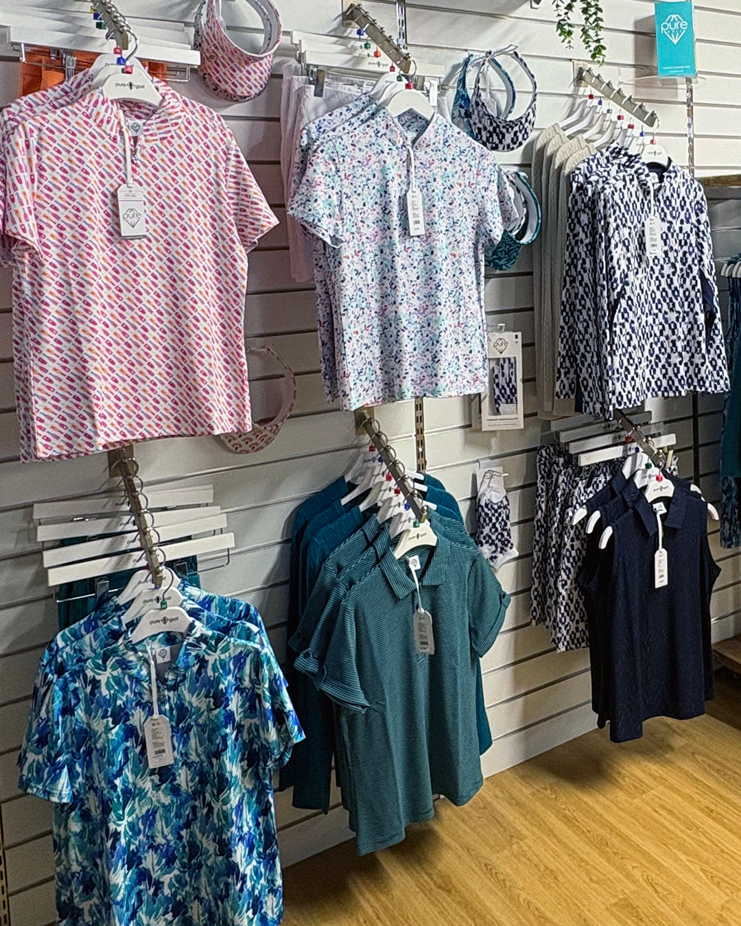 Pure Golf polo shirts, tops and matching visors from GolfGarb on display at Tony Valentine Golf Centre Corsham