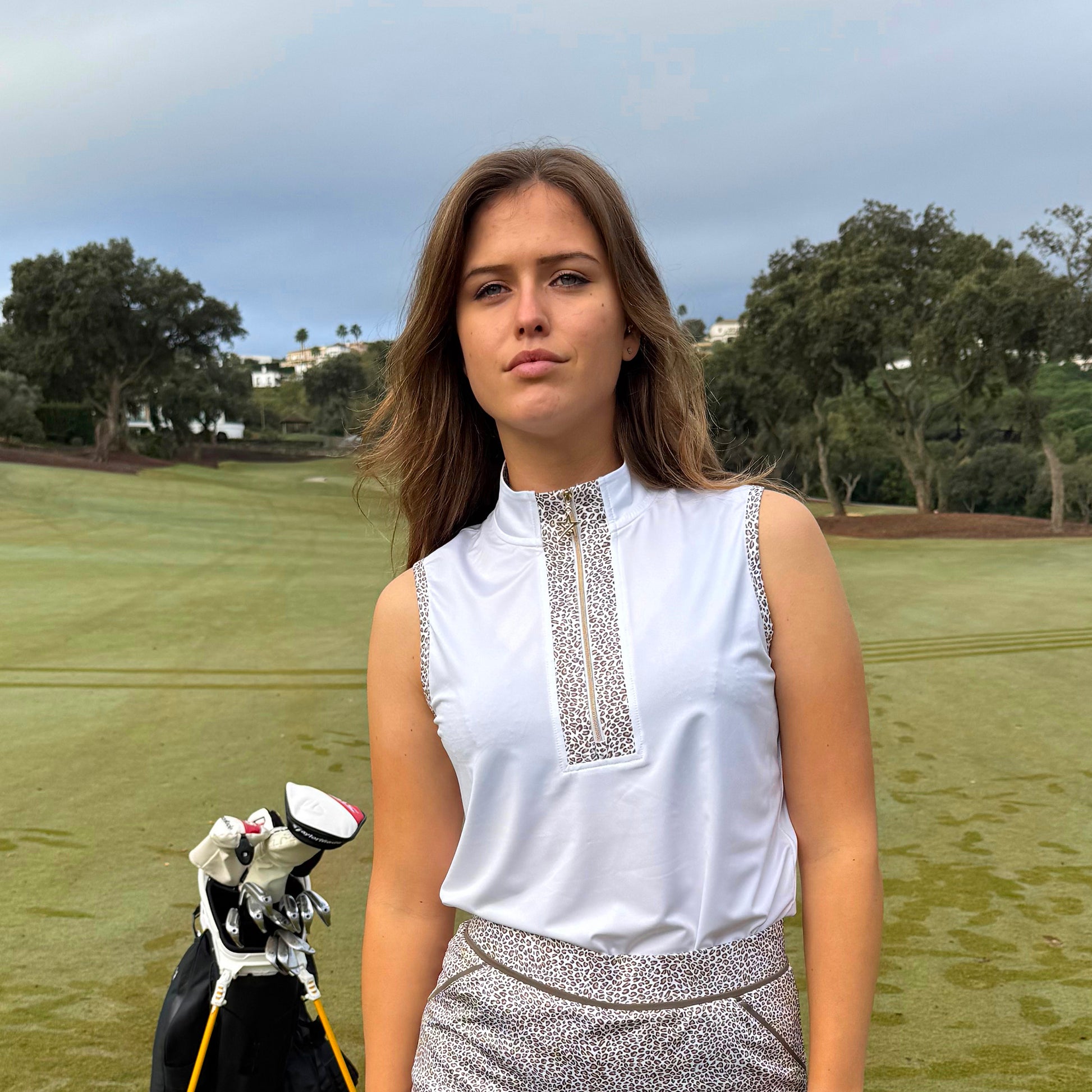 Swing Out Sister Ladies Zip-Neck Sleeveless Polo with Leopard Print Trim