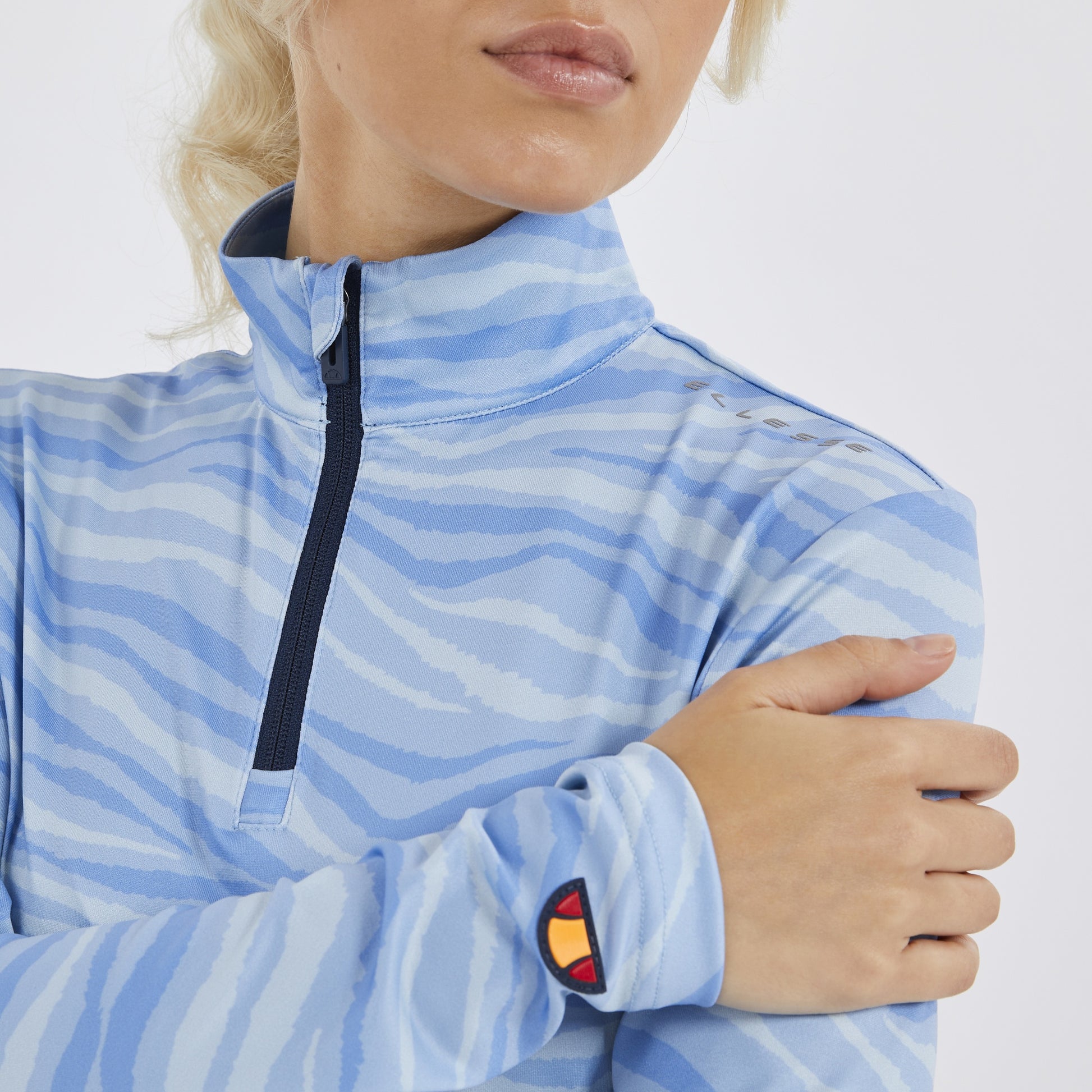 Ellesse Light Blue Zip-Neck Top with Abstract Wave Print