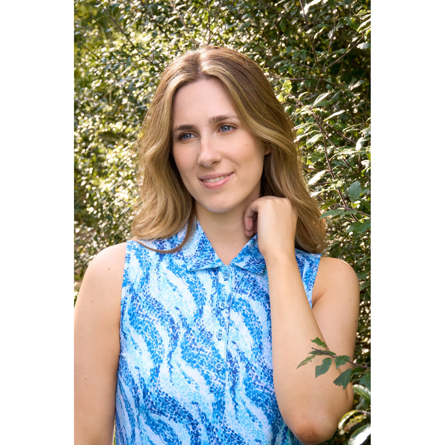 Pure Ladies Sleeveless Buttoned Polo in Flowing Wave Print for Playful Style & All-Day Comfort 