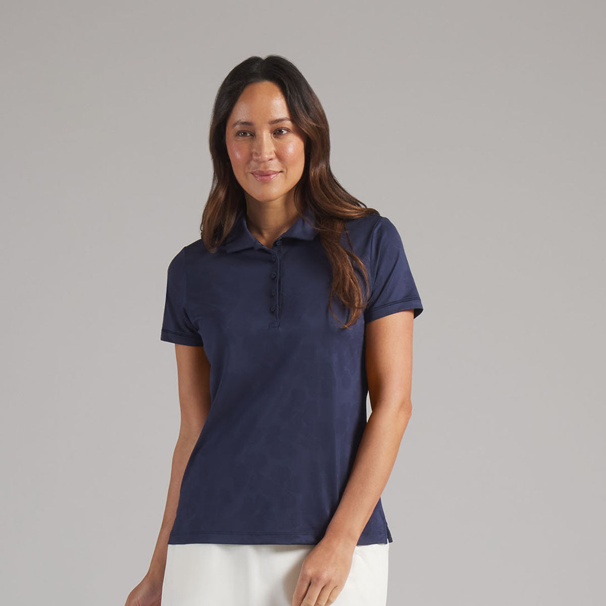 Puma Golf Ladies Short Sleeve Polo with Elegant Floral Jaquard Detail in Navy