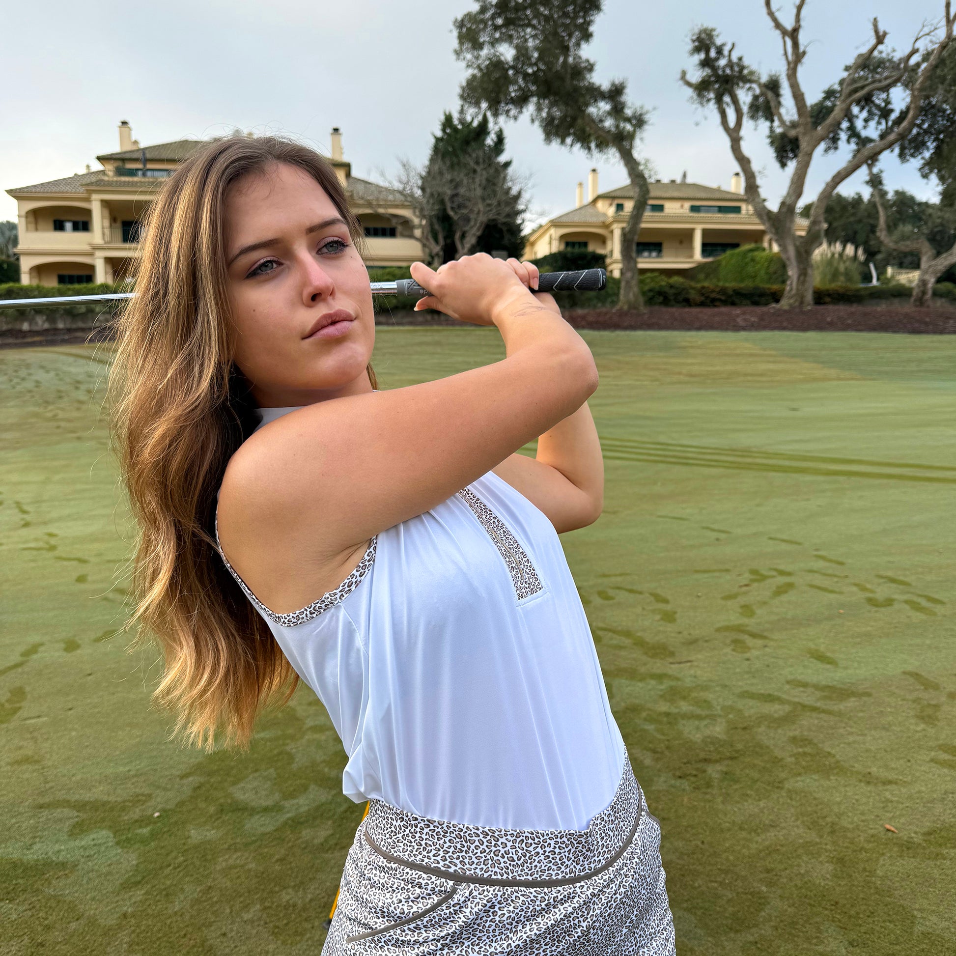 Swing Out Sister Ladies Zip-Neck Sleeveless Polo with Leopard Print Trim