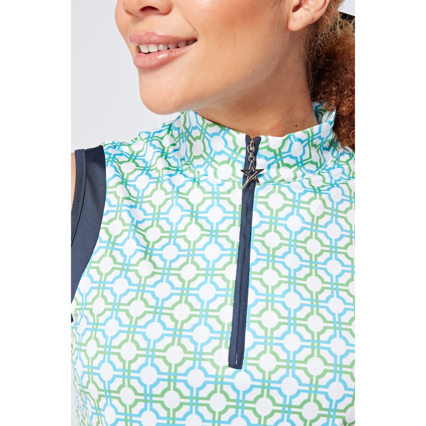 Swing Out Sister Ladies Sleeveless Zip-Neck Polo in Dazzling Blue and Emerald Mosaic Pattern