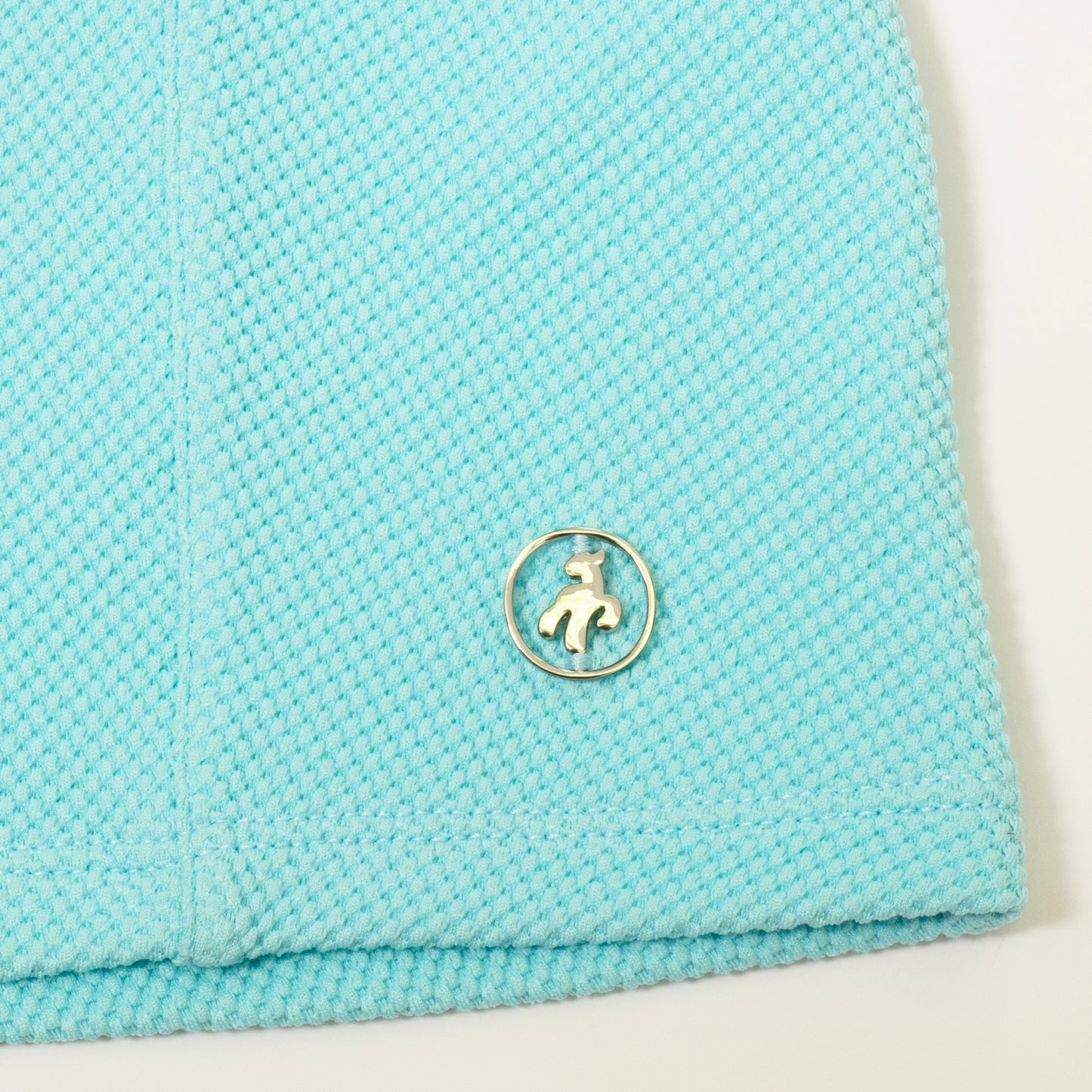 Green Lamb Women's Zip-Neck Golf Top in Aqua Blue with Waffle Design