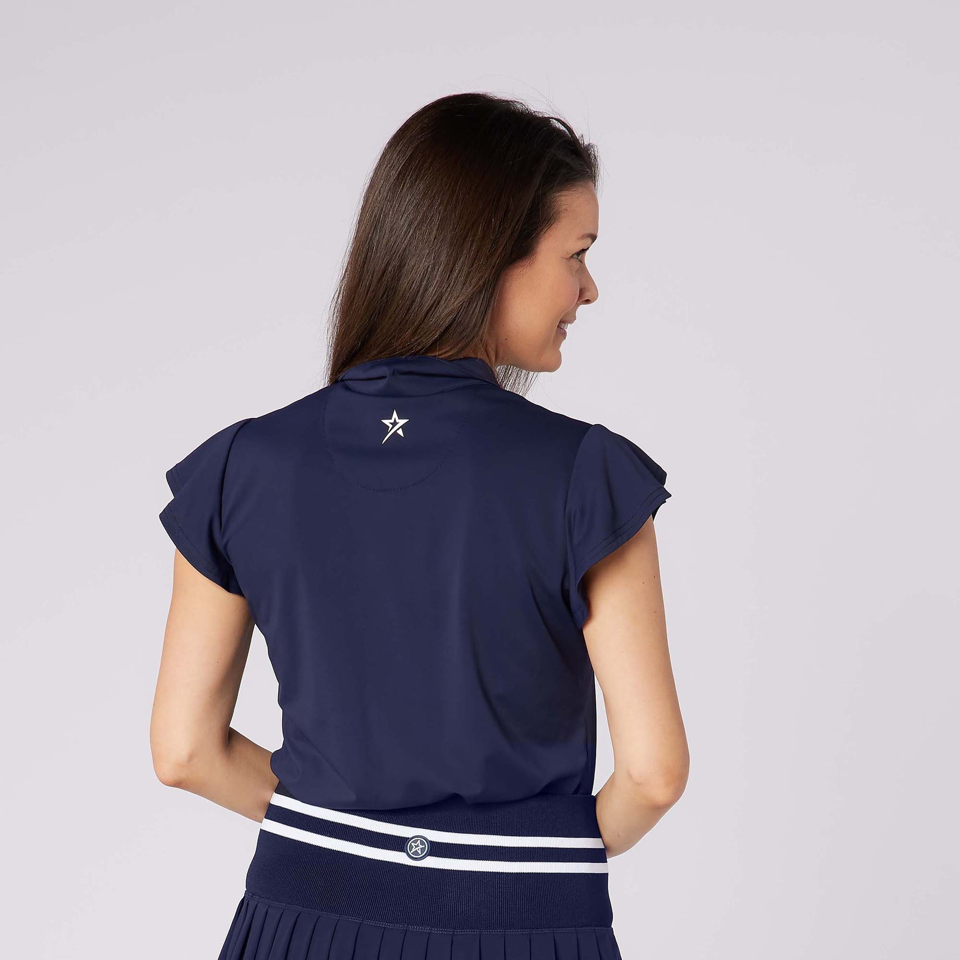 Swing Out Sister Ladies Fluted Sleeve Navy Polo for Elegant Flair On & Off The Course