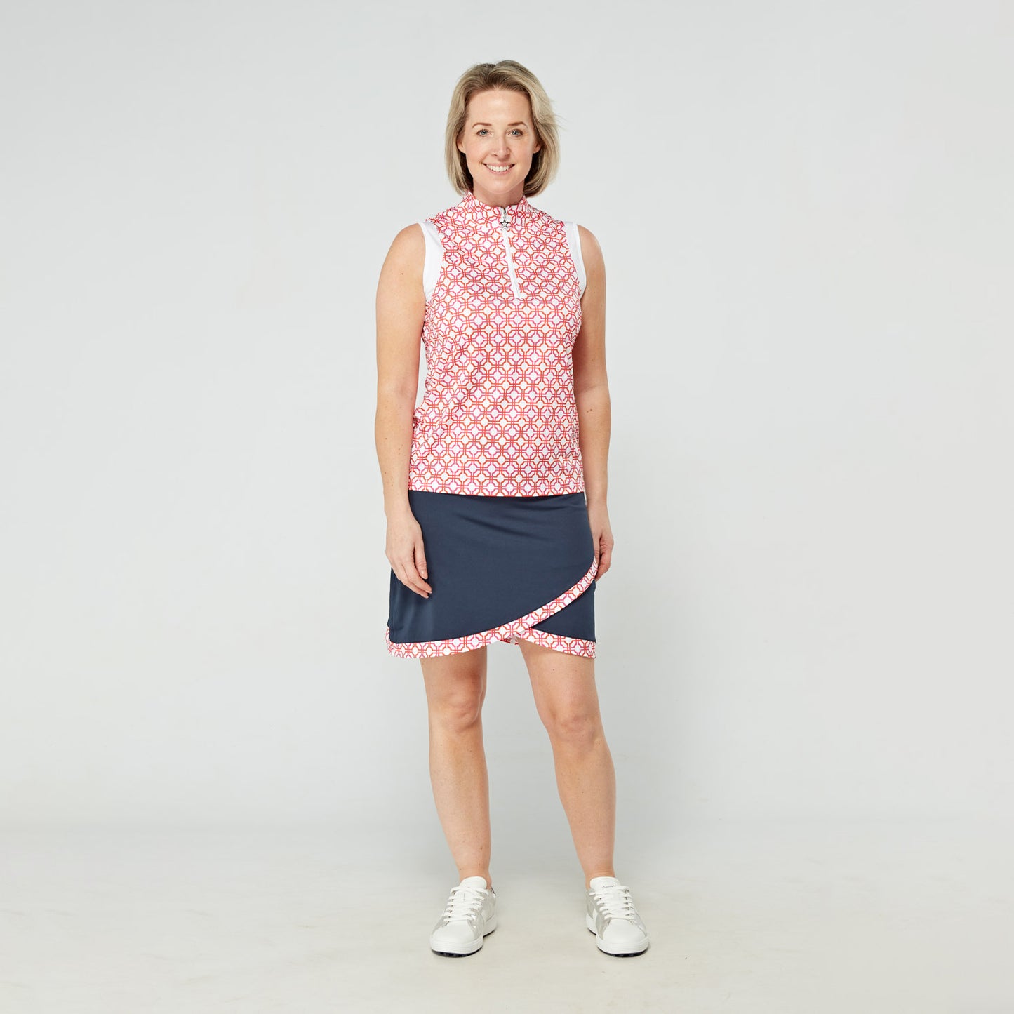 Swing Out Sister Sleeveless Zip-Neck Polo in Lush Pink and Mandarin Mosaic Print